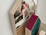 a wooden pallet with a bed and a mirror on it