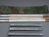 several different types of knives and sheaths laid out on a table