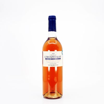 an image of a bottle of whiskey sitting on a white surface