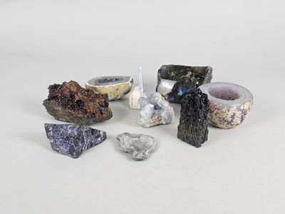 several different types of rocks and stones on a white surface