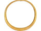 a gold necklace on a white background