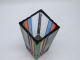 a glass vase with a multicolored design on it