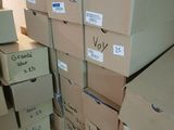 several boxes are stacked on top of each other in a room