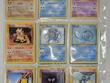 a lot of pokemon cards on the table