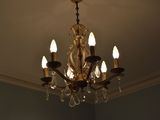 a chandelier that is hanging from the ceiling