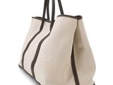 an image of a white bag with brown trims on it