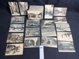 several old postcards of different types and sizes on a table