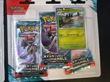 two packs of pokemon cards on a black table