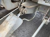 a shovel that is sitting on the side of a truck