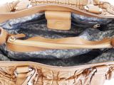 the inside of a tan handbag with a zipper and a handle