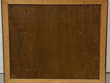 an old wooden picture frame with a black border on a white wall
