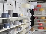 many pots and pans on the shelves in the store
