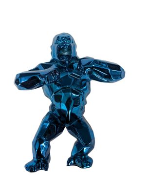 a shiny blue statue of a man holding his hands out