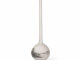a white vase that has a black and white design on it
