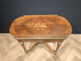 an image of a wooden table with a floral design on it