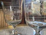 two empty wine glasses sitting on a table
