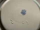 a white plate with a blue and white design on it
