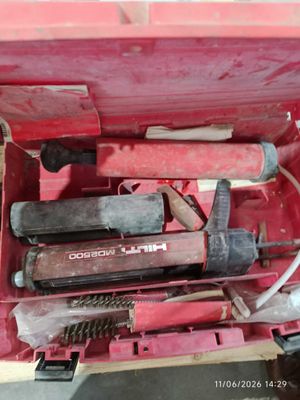 a red tool box with tools inside of it