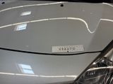a close up of a car ' s hood with a sticker on it