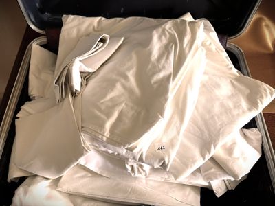 a piece of luggage that is packed with clothes