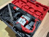 a red box with tools in it on a table