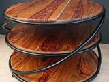 a wooden table with three tiers on it