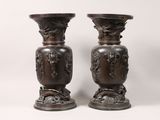 two vases that are sitting next to each other on a table