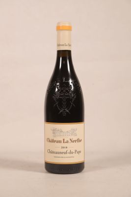 a bottle of wine that is sitting on a table