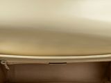 the inside of a beige purse with a zipper on the inside