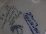 a close up of a plate with a tag on it