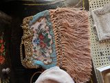 a purse and a hat sitting on top of a table