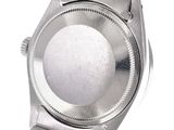 a close up of a wrist watch on a white background