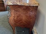 an image of a marble top dresser in a room