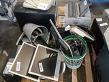 a pile of computer equipment sitting on a pallet in a warehouse