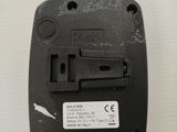 a close up of a black electronic device on a table
