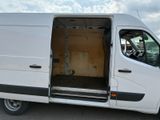 a white van with its doors open in a parking lot