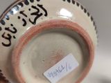 a close up of a cup with writing on it