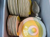 a lot of plates and bowls in a box