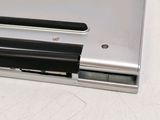 a close up of a laptop with a battery on it