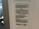 a refrigerator that has a sign on the side of it