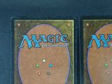 two decks of magic the gathering are shown on a table