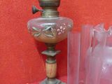 a lamp that is sitting on a table next to some vases