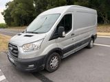 a silver van that is parked on the side of the road