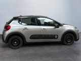 the silver car is parked in the room on the concrete floor