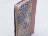 a small book that is sitting in the snow