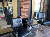 two chairs that are sitting in front of a mirror