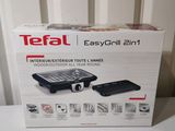 the box of the tefa easy grill is open and ready to be used