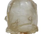 a glass vase with a fish design on it