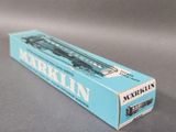 an image of a blue box with a train on it on a table