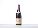 a bottle of wine that is sitting on a table